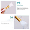 A cosmetic applicator brush with a gold handle and white silicone head is shown, demonstrating easy handling and cleaning.
