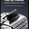 Close-up of a silver pop-up trimmer for precision grooming, showing the trimming head and body.