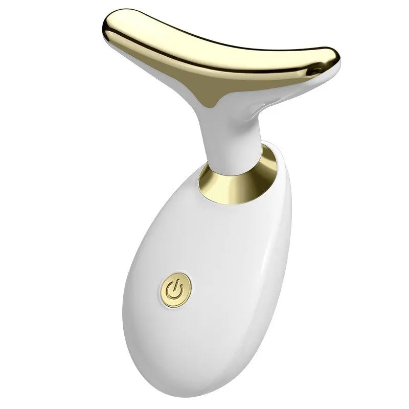 A white electric facial lifting and firming massager with a gold accent.