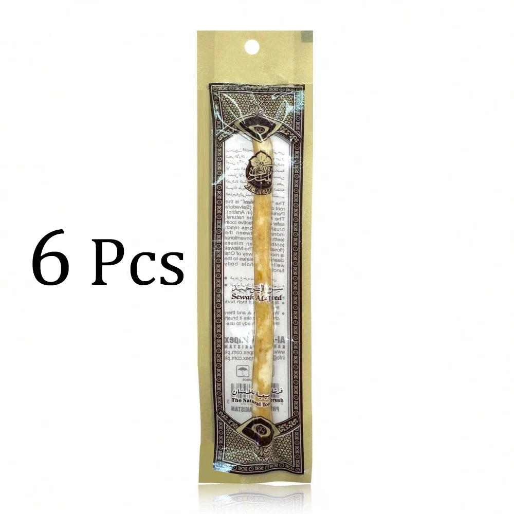 Six pieces of traditional wooden miswak toothbrushes packaged in a clear plastic pouch