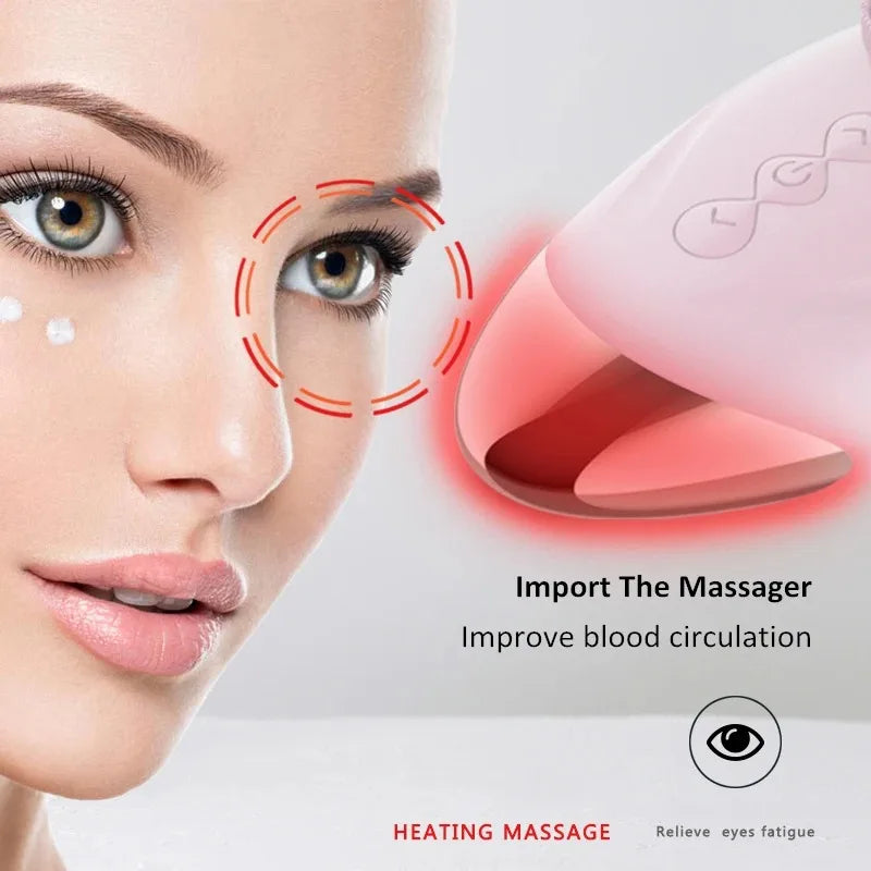 A close-up of a woman's face showing a pink massaging device used for heating massage to relieve eye fatigue.