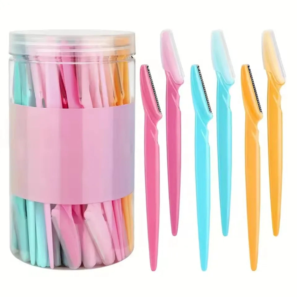 A collection of pink, teal, and yellow stainless steel eyebrow trimmers in a clear container.