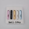 A set of five refillable mini perfume spray bottles in various colors including pink, black, gold, silver, and blue, displaye