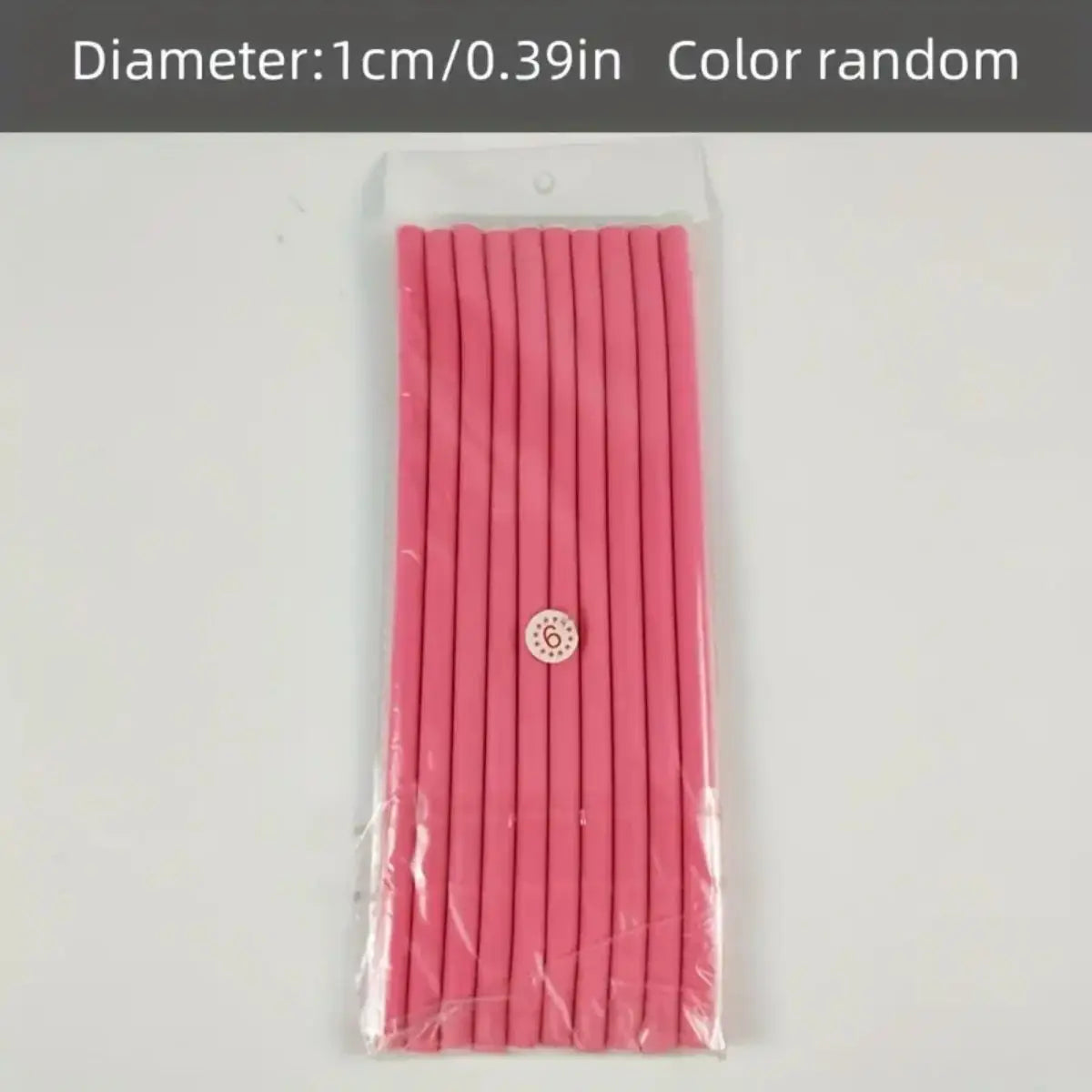 A package of pink soft foam heatless hair rollers with a circular marker on the center.