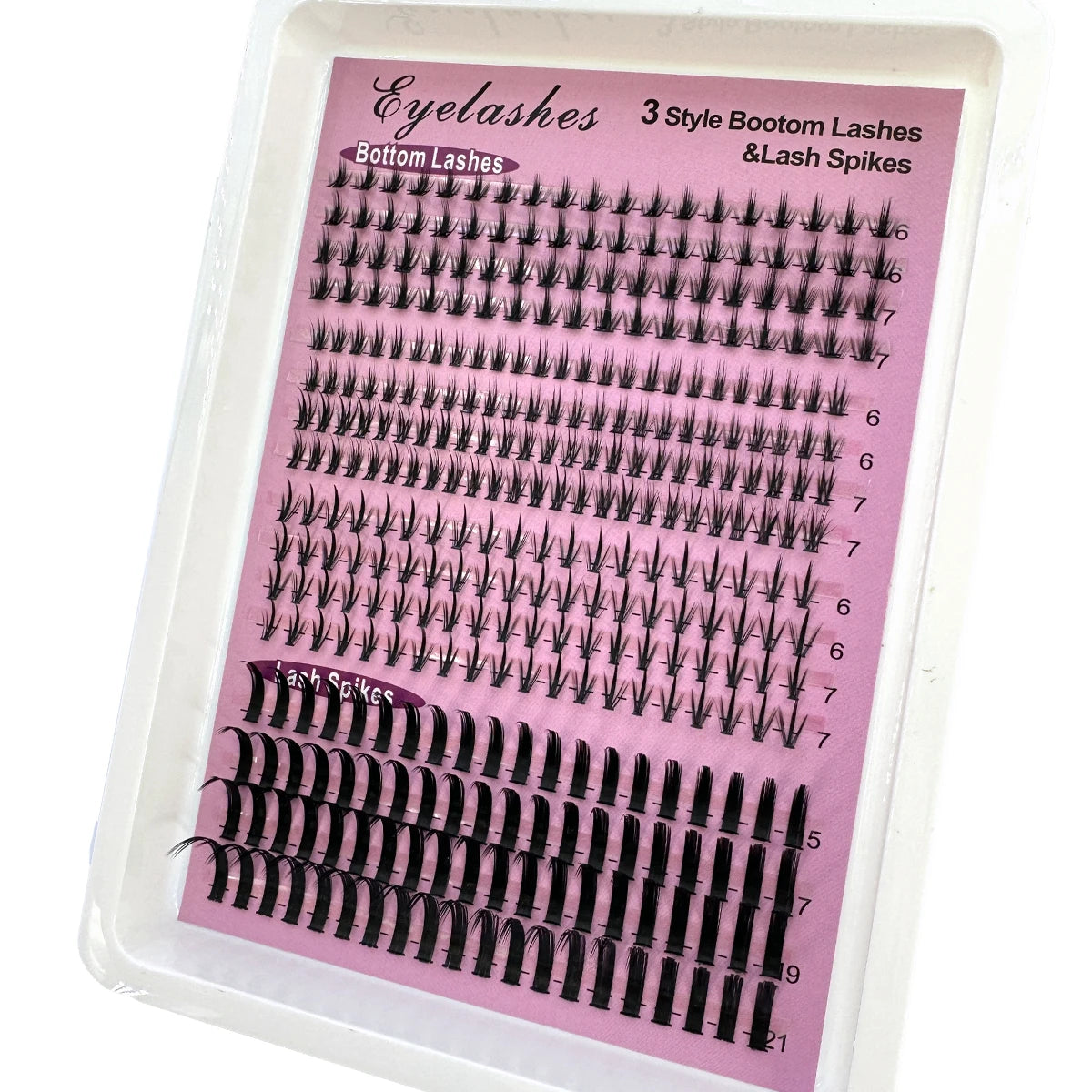 A plastic tray displaying various styles of eyelash extensions including bottom lashes and lash spikes.