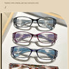 A collection of five polychrome reading glasses displayed on a white background.