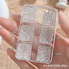 A clear box containing six different sizes of mixed stainless steel beads for nail art decorations