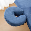 A blue reusable U-shape pillow cover used for massage or beauty treatments.