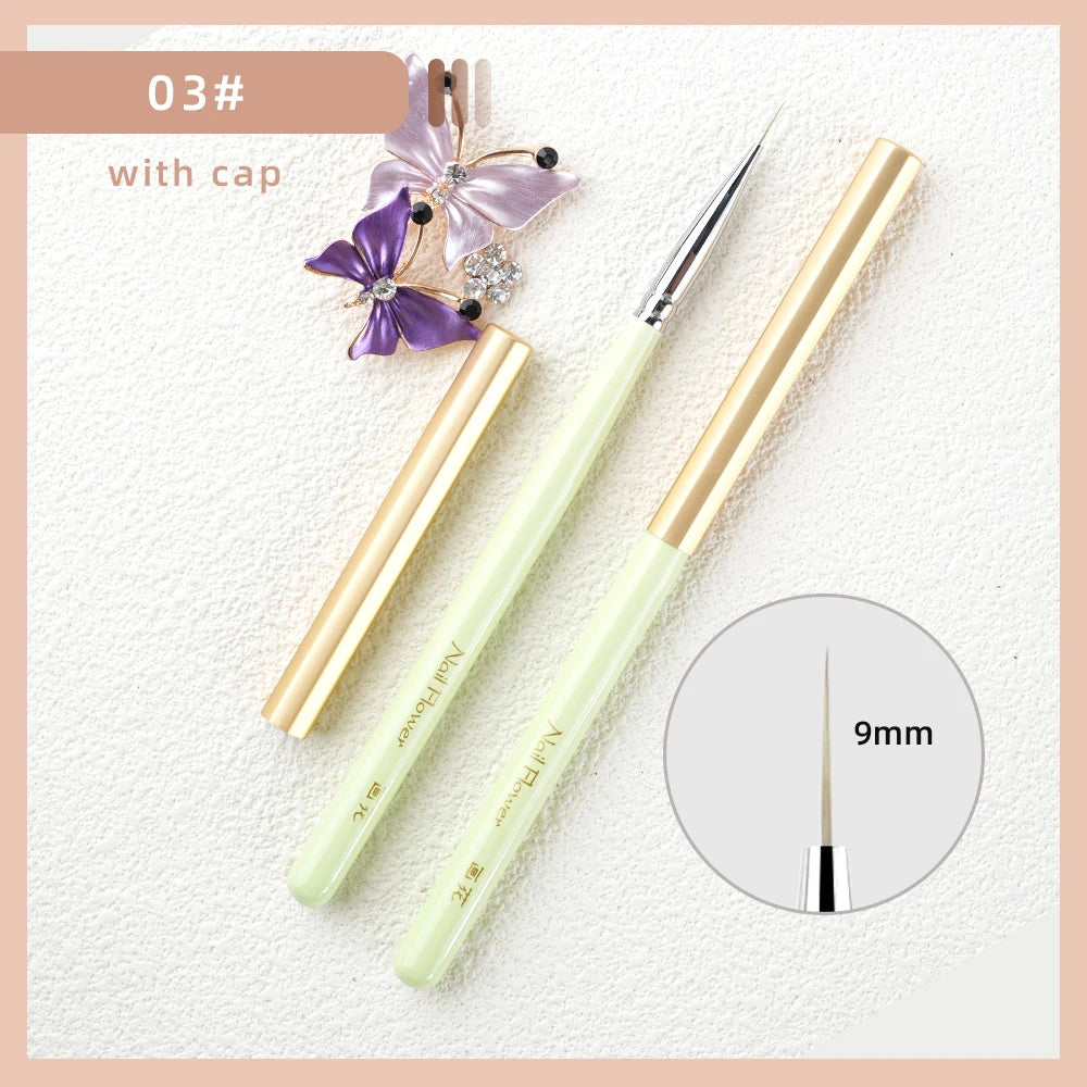 A set of professional nail art brushes with a cap, featuring a light green handle and gold accents.