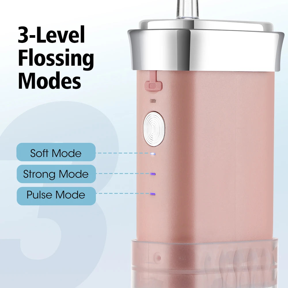 A pink portable high-pressure oral irrigator device showing three floss modes: Soft, Strong, and Pulse.