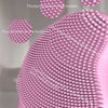 Close-up of a pink USB rechargeable facial cleansing brush showing various bristle types for deep cleaning.