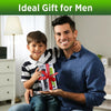A man is holding a box of precision rechargeable beard trimmers for men with a smiling child beside him.