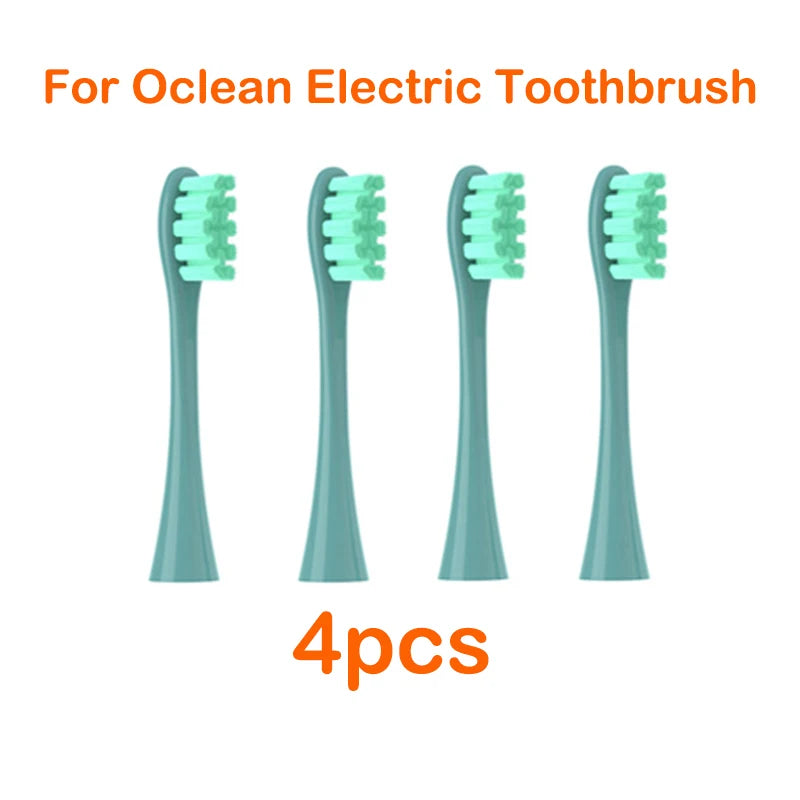 Four replacement brush heads for an Ocean electric toothbrush are shown.
