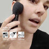 A woman is using a black silicone facial cleansing brush on her face, demonstrating its use in various scenarios like faucet,
