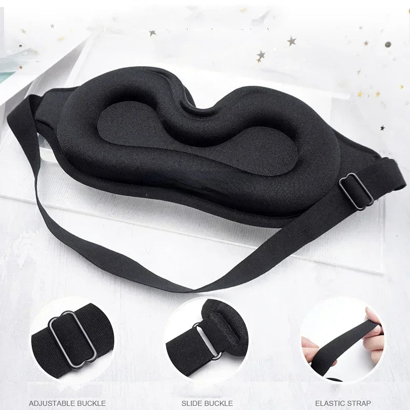 Black adjustable strap eye mask with slide buckle and elastic strap shown on a white background