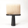 A light beige soft bristle hair duster brush resting on a black stand.