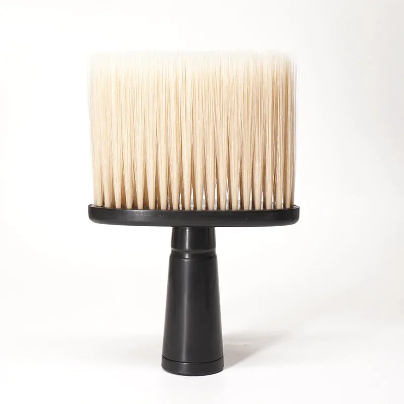 A light beige soft bristle hair duster brush resting on a black stand.