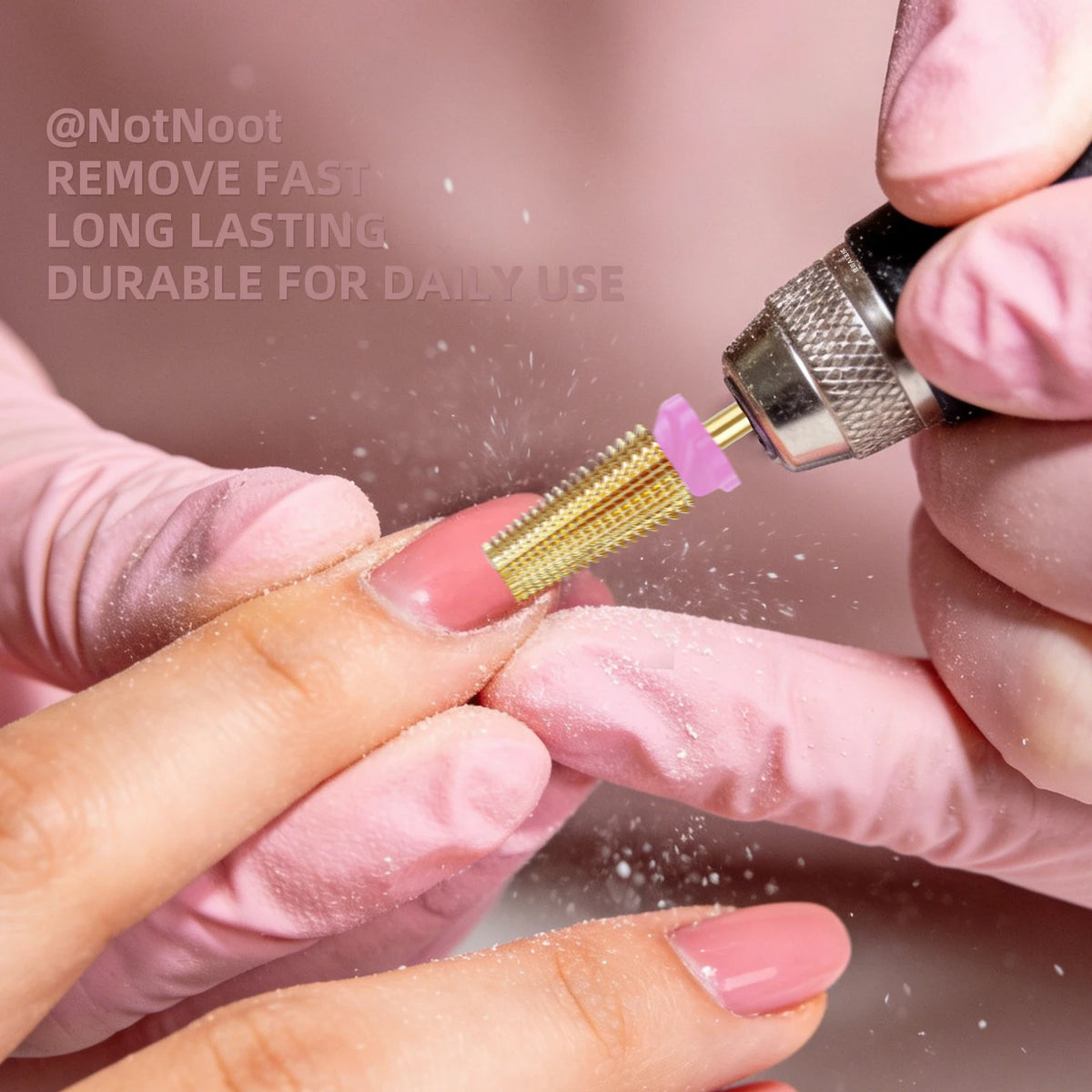 Hands using a carbide nail drill bit set to file or shape a nail, demonstrating its use for manicure and pedicure.