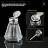 A clear glass bottle with a metal tube and plum blossom pump head for liquid application.