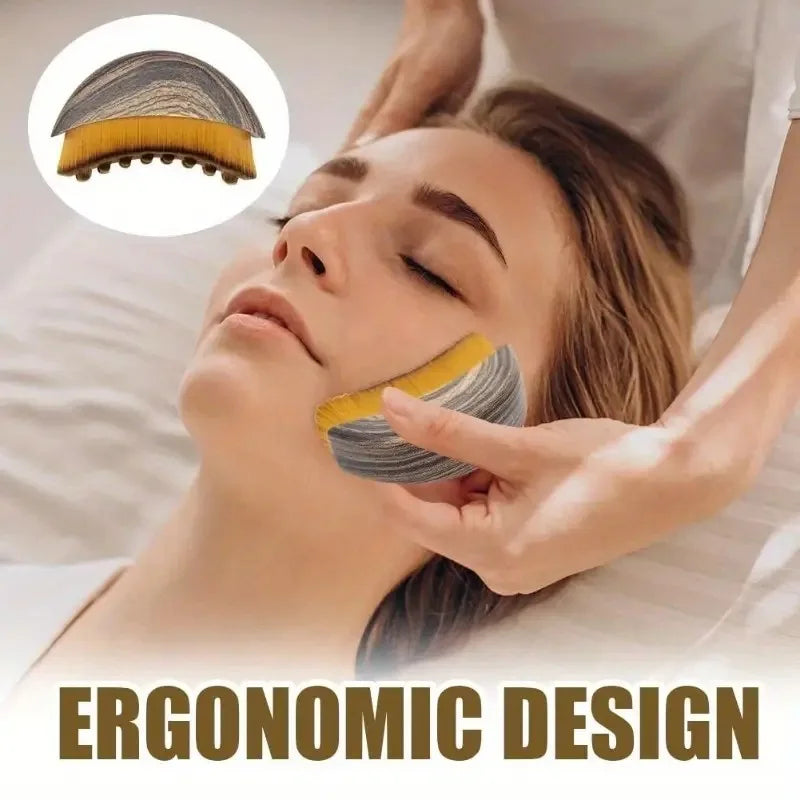 A woman is receiving a lymphatic contour facial massage using a brush with gray and yellow bristles on her face.