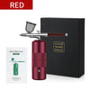 A red mini air compressor nail art spray tool is shown next to its black box and instruction sheet.