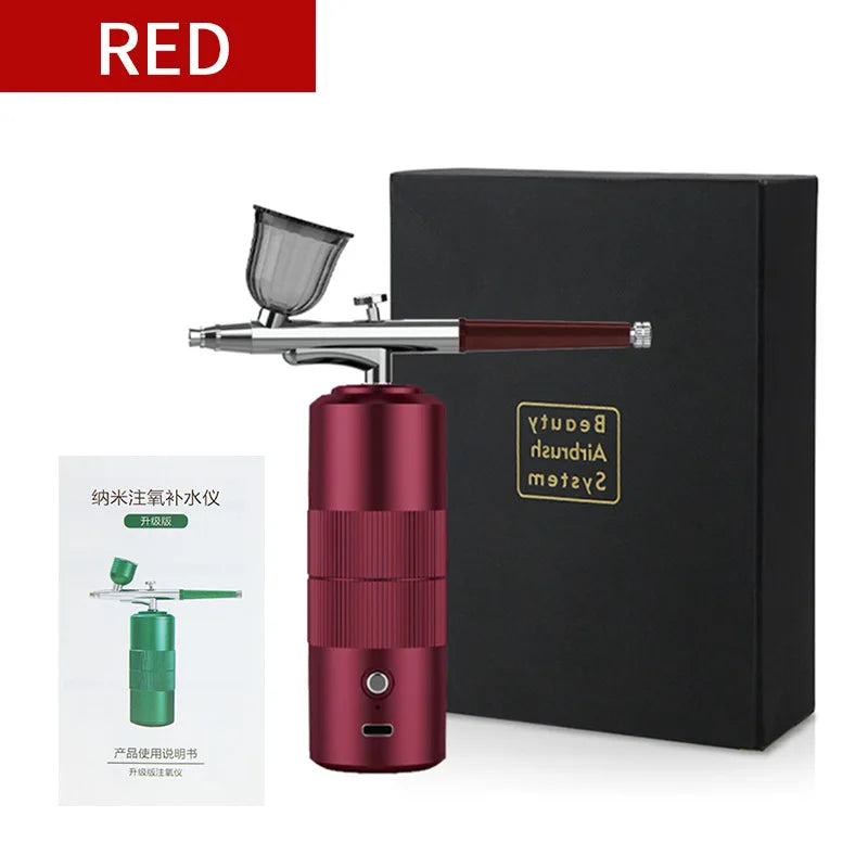 A red mini air compressor nail art spray tool is shown next to its black box and instruction sheet.