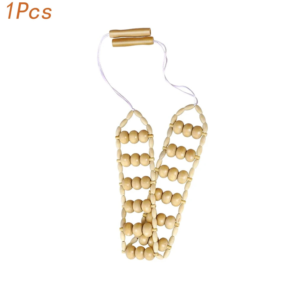 Natural wood gua sha roller with a thin cord and a gold-colored handle
