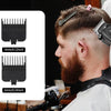 A man is using a professional cordless electric hair trimmer kit with various guard attachments on his haircut.