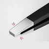 A close-up view of precision stainless steel eyebrow tweezers with a black handle and silver tip.