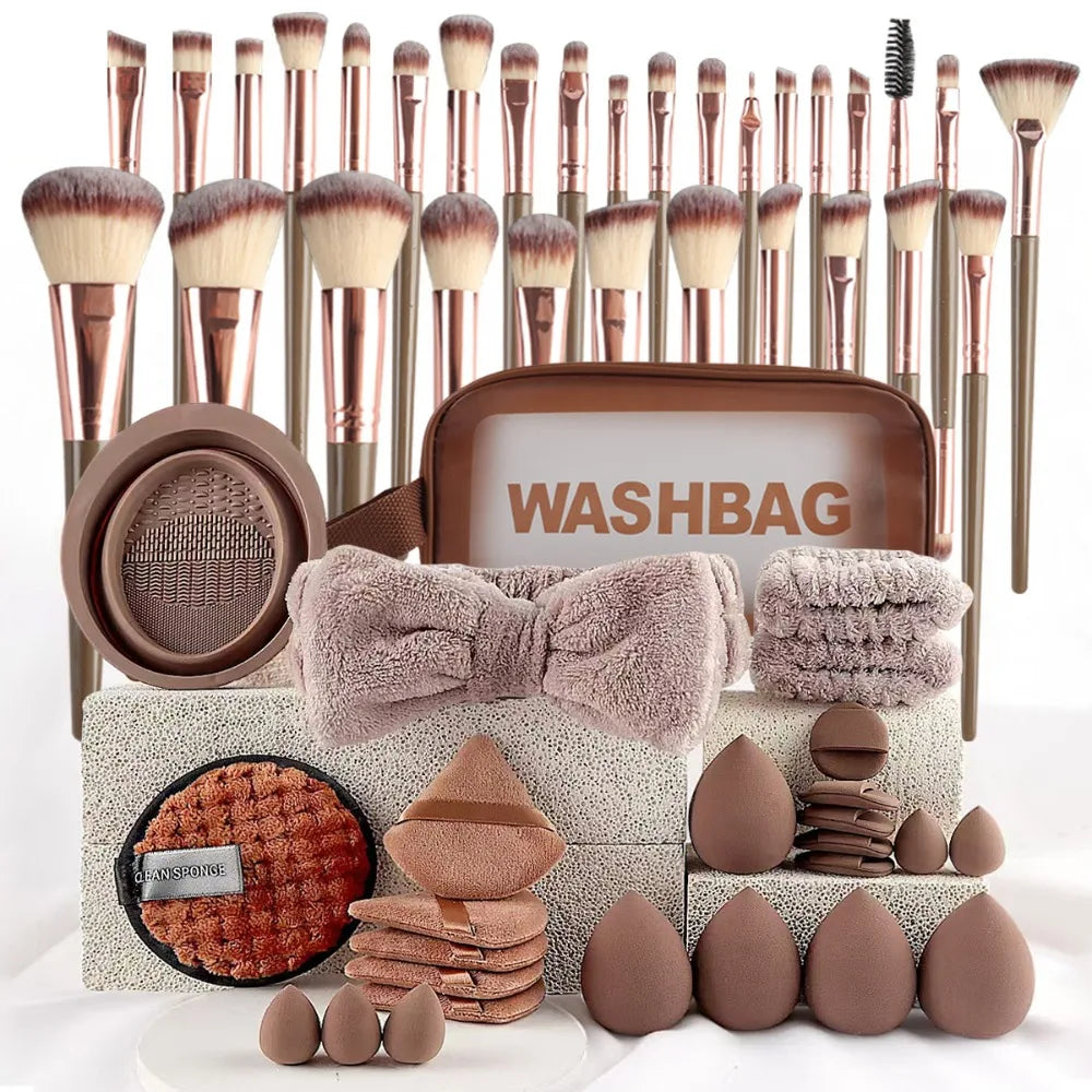 A collection of makeup brushes and tools displayed in a brown washbag with various brush heads and applicators.