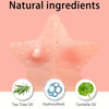 A close-up of skin showing natural ingredients like tea tree oil, hydrocolloid, and centella oil for blemish care.