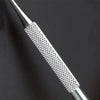 Close-up of a stainless steel ingrown toenail pedicure tool with a textured tip.