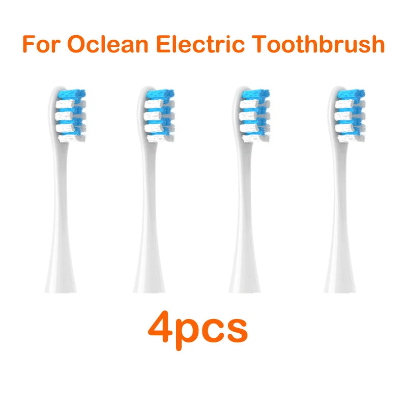 Four replacement brush heads for an Ocean electric toothbrush are shown.