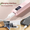 A pink handheld UV nail dryer lamp is shown with a charging interface and a power cord.