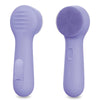 A purple silicone facial cleansing brush shown from the side.