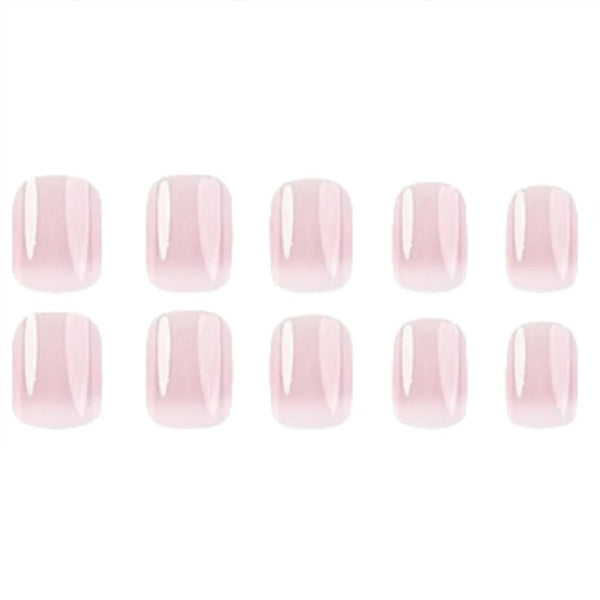 A set of pink French style press-on nails with glue.