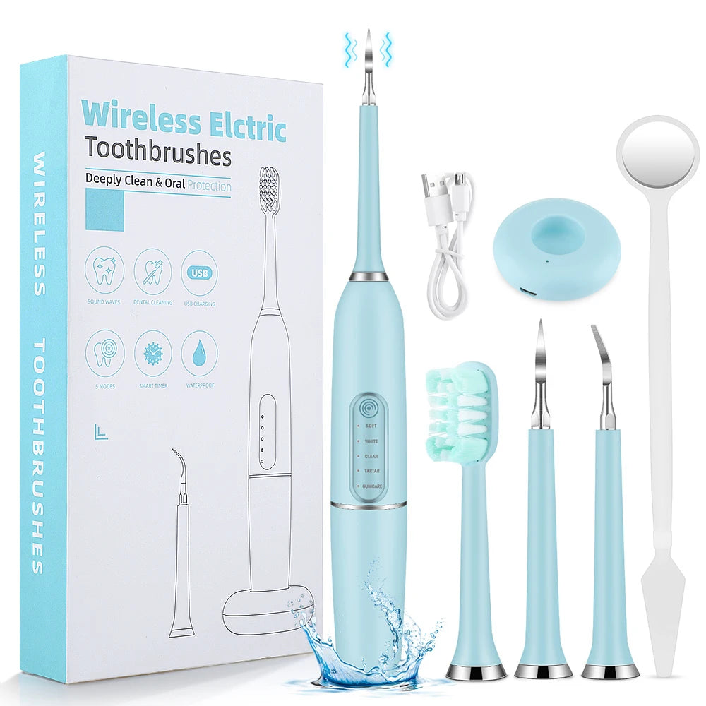 A box of wireless electric toothbrushes and various dental tools including a scaler and cleaning brush.