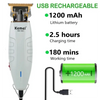 A white cordless hair clipper with a gold charging head and a green battery shown next to the device.