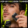 A man is using a pop-up precision trimmer on his face to trim facial hair.