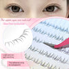 Close-up of natural individual clusters of adhesive lashes being applied to an eye for DIY enhancement.