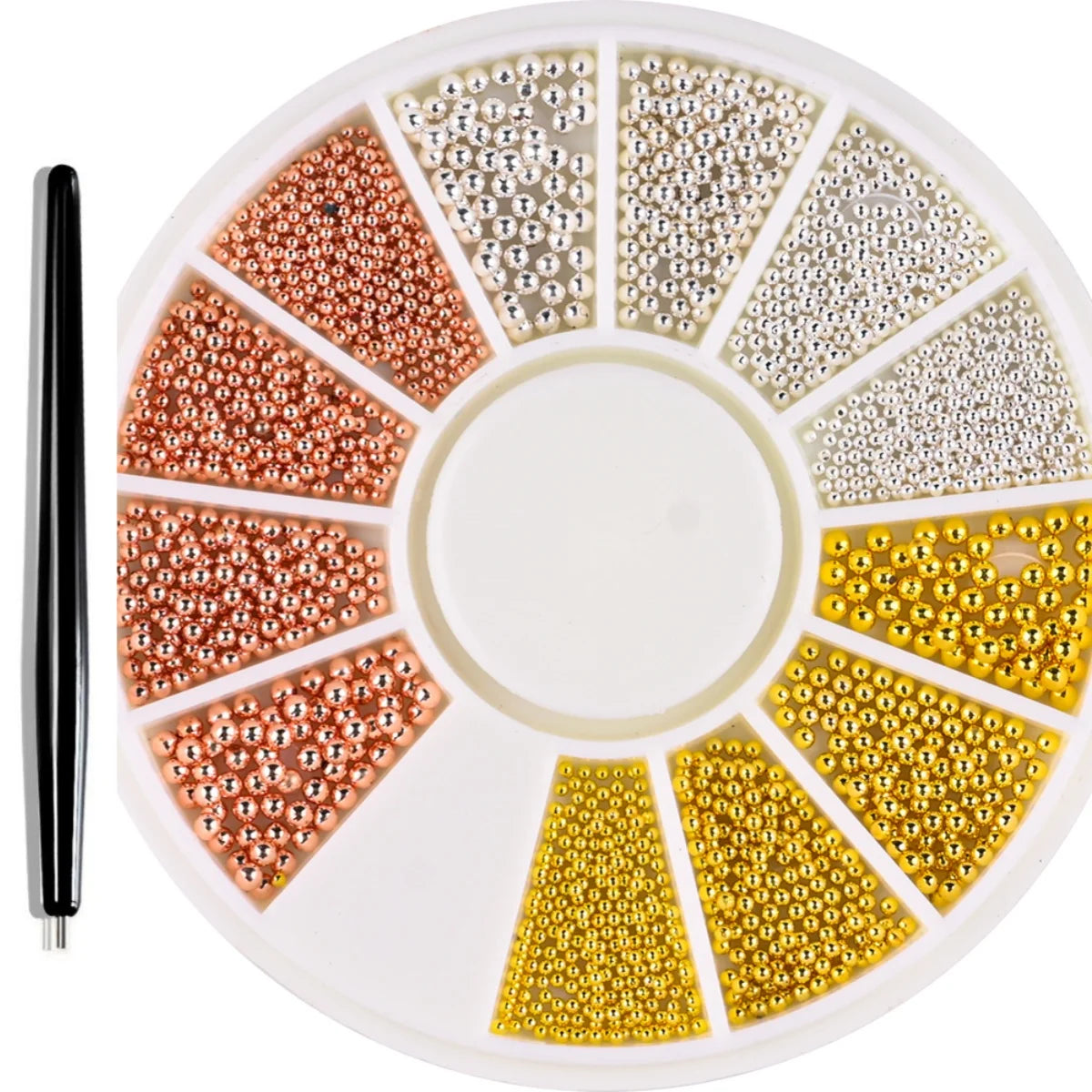 A circular tray of gold mixed stainless steel bead nail art decorations in various shades and sizes.