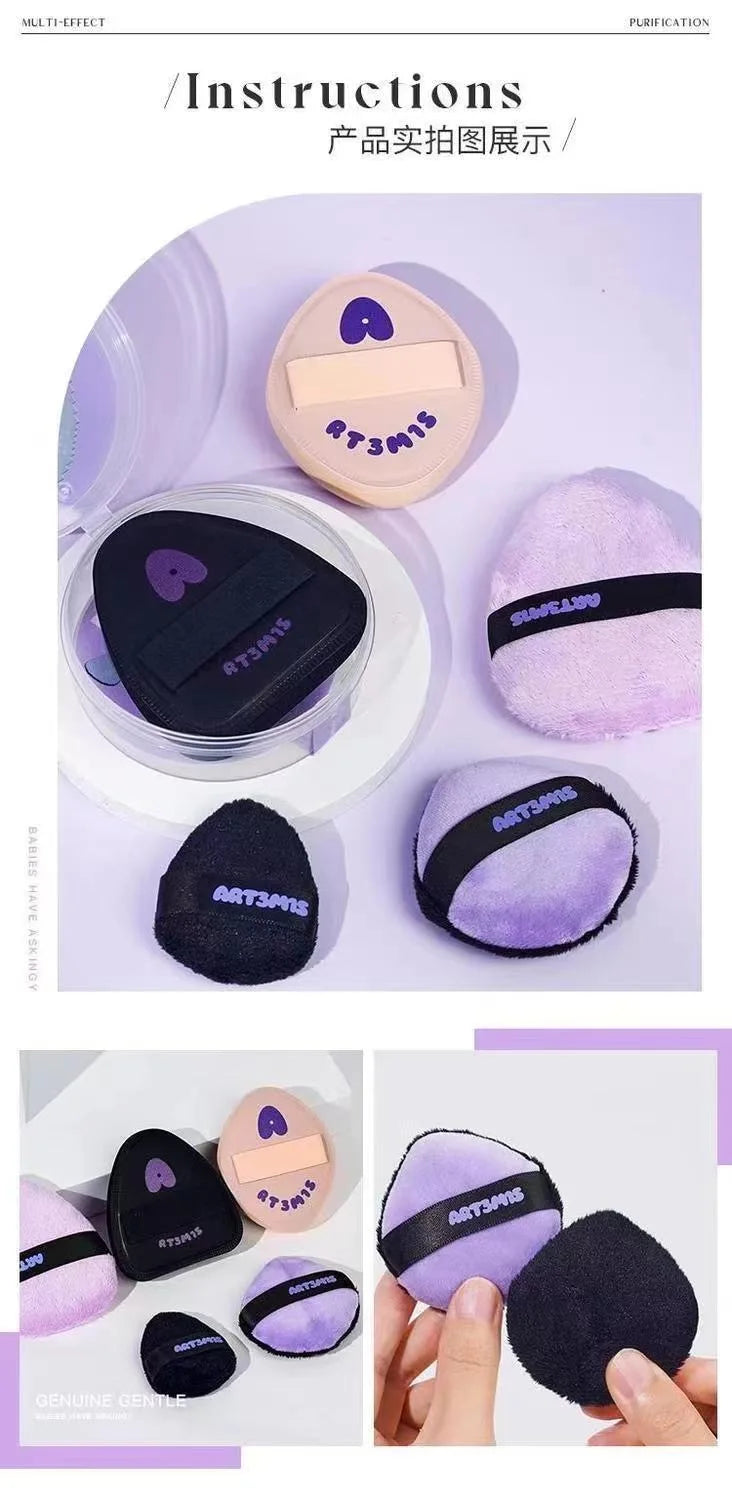 Collection de puffs cosmétiques flockés rose et noir, de différentes tailles et textures.