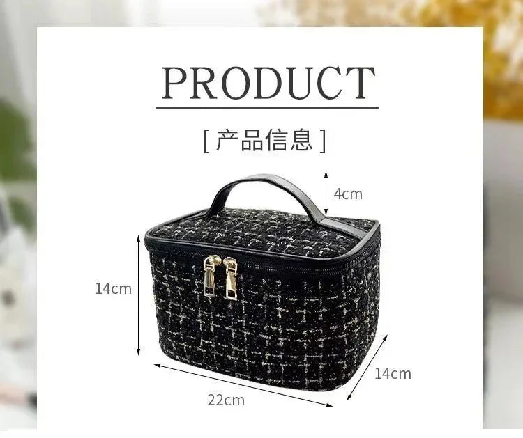 Black knitted canvas makeup pouch with a lid shown in a product photo.