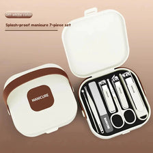 An off-white manicure 7-piece set with various nail clippers and tools displayed in an open storage case.