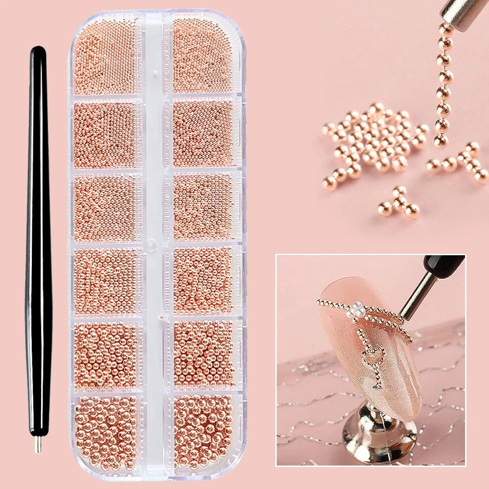 A clear plastic case filled with gold mixed stainless steel bead nail art decorations and a display of finished nail art.