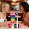 Two women smiling while using Feimuko 2-in-1 tongue cleaning gel and brush kit