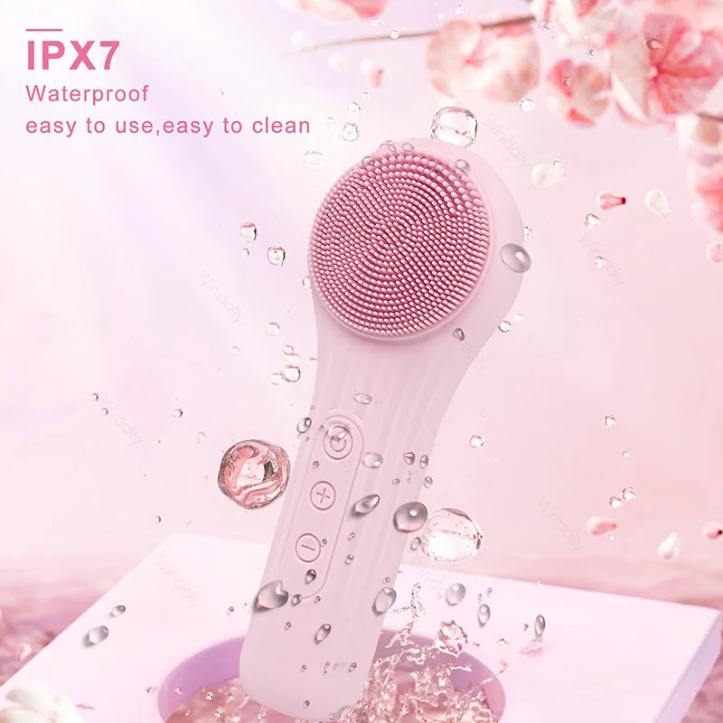 A white sonic waterproof facial cleansing brush is shown against a pink background with water droplets.