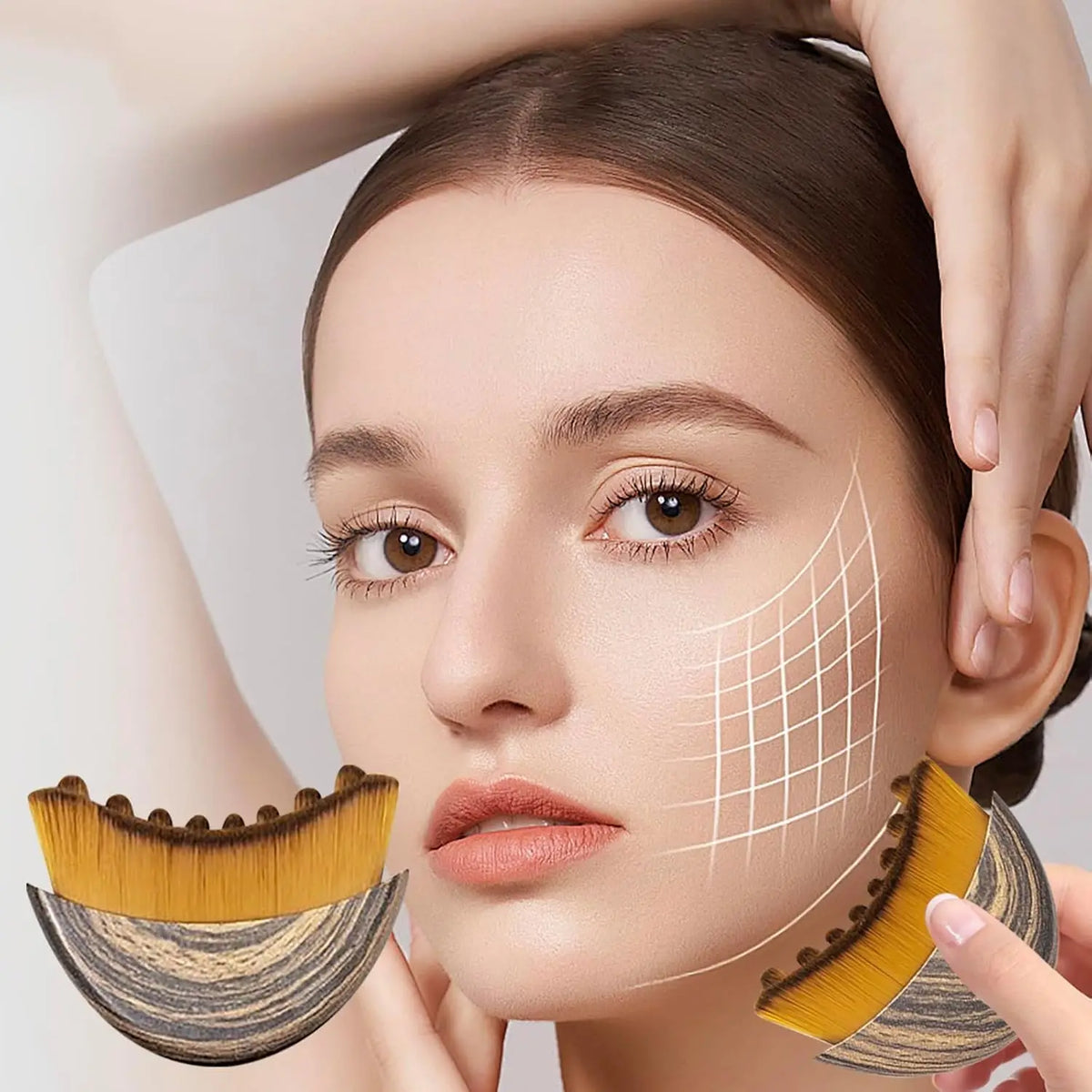 A woman is using a lymphatic contour face brush on her face.