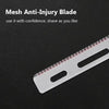 A close-up view of a mesh anti-injury blade, a stainless steel razor blade, lying on a dark surface.