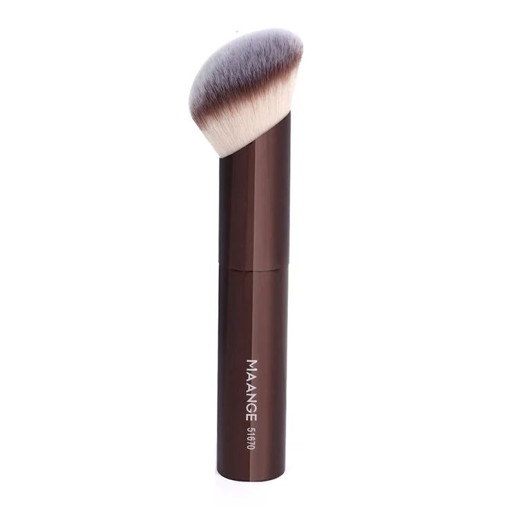 A brown makeup brush with a fluffy synthetic hair bristles is shown against a white background.